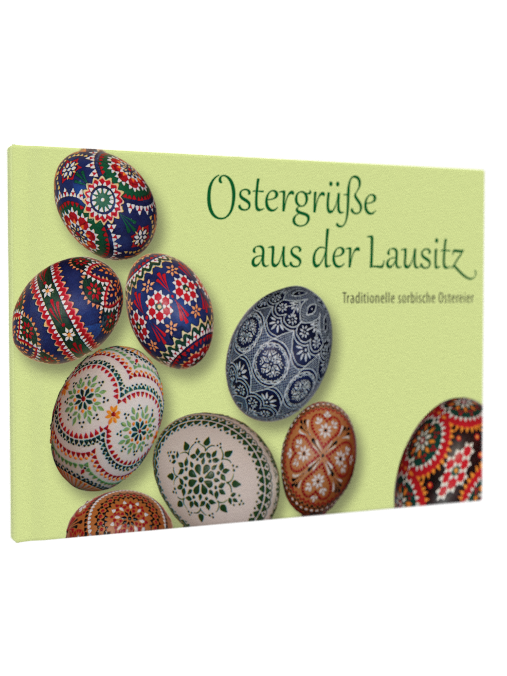 Buchcover von 'Ostergrüße aus der Lausitz – Traditionelle sorbische Ostereier'. Abgebildet sind kunstvoll verzierte Ostereier mit filigranen Mustern in Rot, Blau, Grün und Weiß auf hellem Hintergrund. Titel in grüner Schrift.